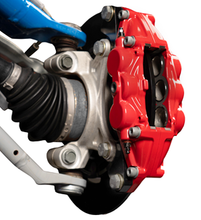 Load image into Gallery viewer, Front UTV corner assembly showing a brake kit installed with red calipers