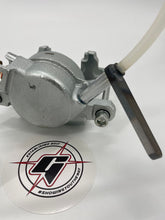 Load image into Gallery viewer, Zoomed in picture of the brake hose fitting connected to a brake caliper
