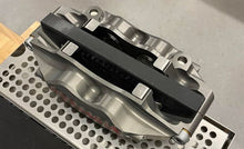 Load image into Gallery viewer, brake pad spacer block that is made of black plastic
