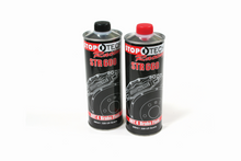 Load image into Gallery viewer, Two cans of brake fluid on a white background
