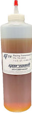 Load image into Gallery viewer, Clear bottle filled with transmission fluid with a white product label
